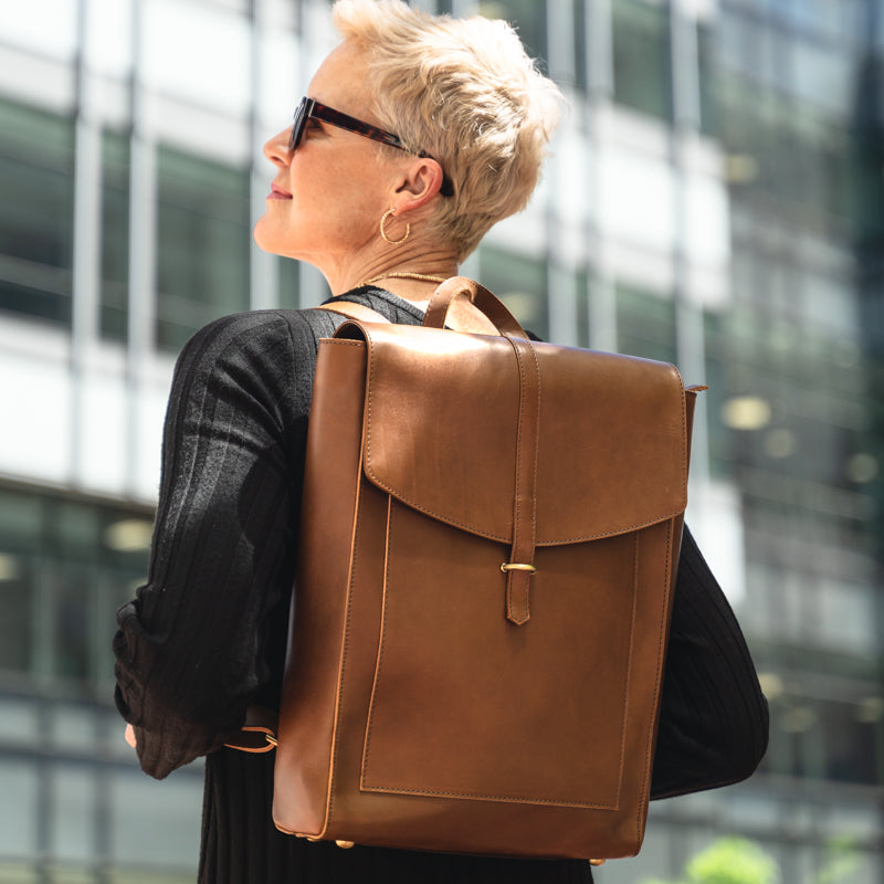 Woman wearing the Atlas leather backpack from Elevate in the city