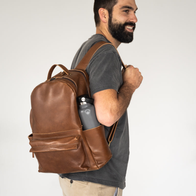 Man wearing Elevate Commuter Backpack