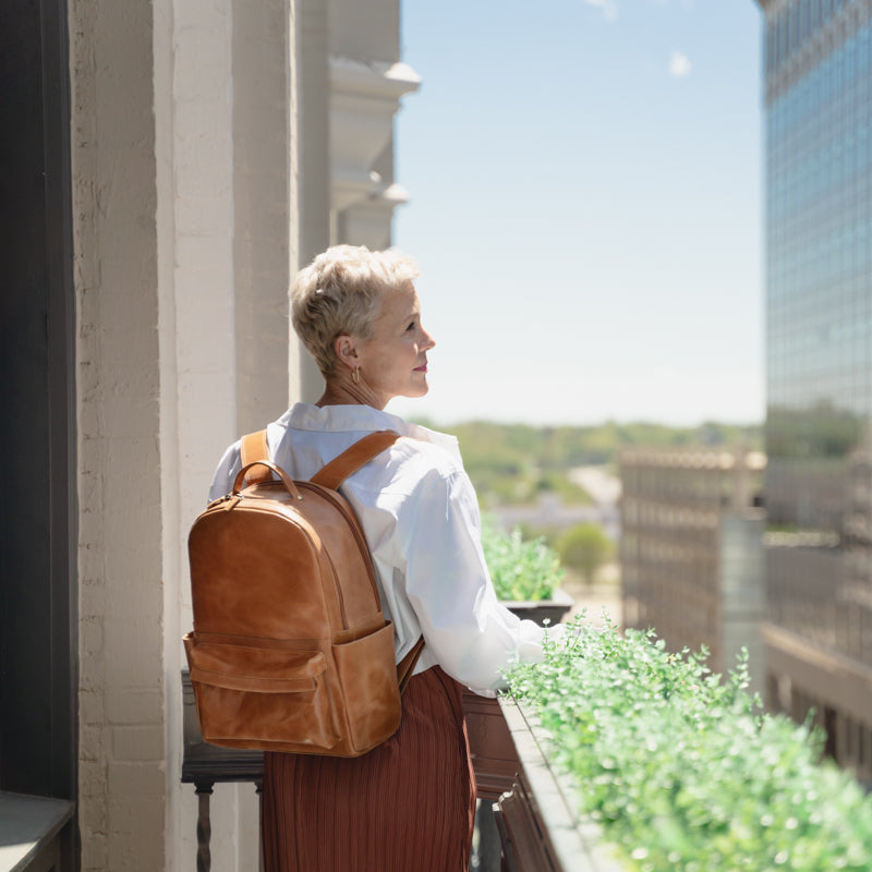 Woman wearing Elevate Commuter Backpack outside