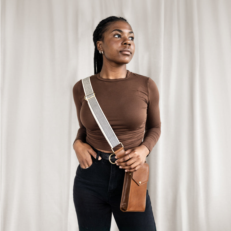 Woman wearing Euro Phone Crossbody by Elevate with Woven Strap