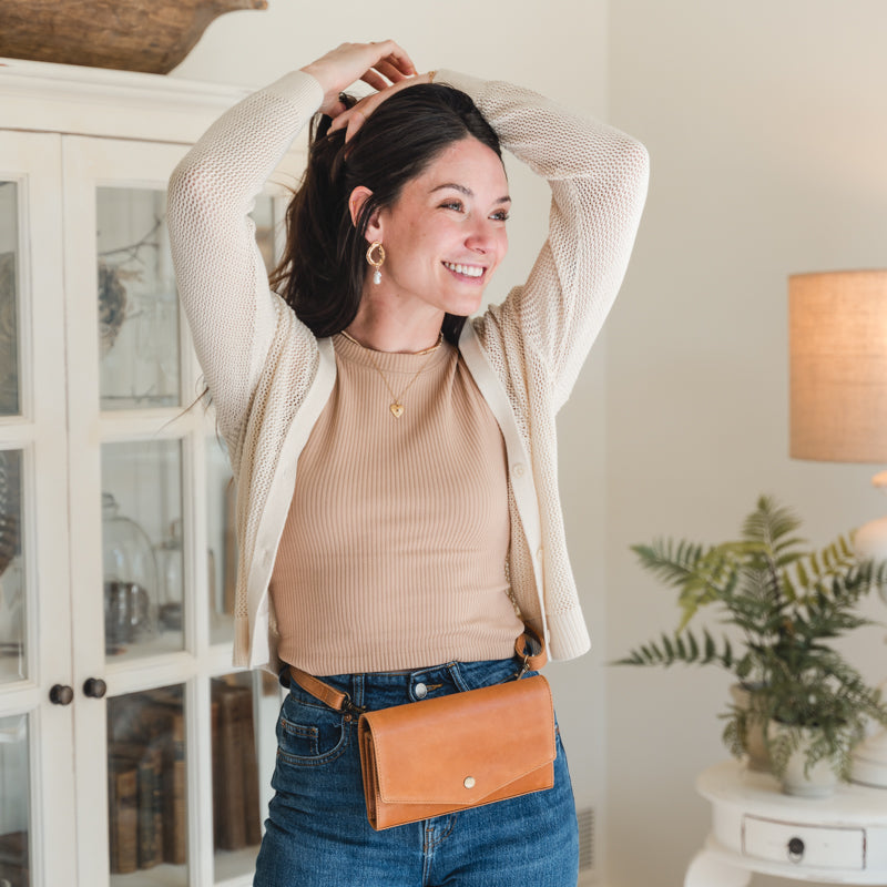 Woman wearing Elevate DiMarco crossbody as a belt